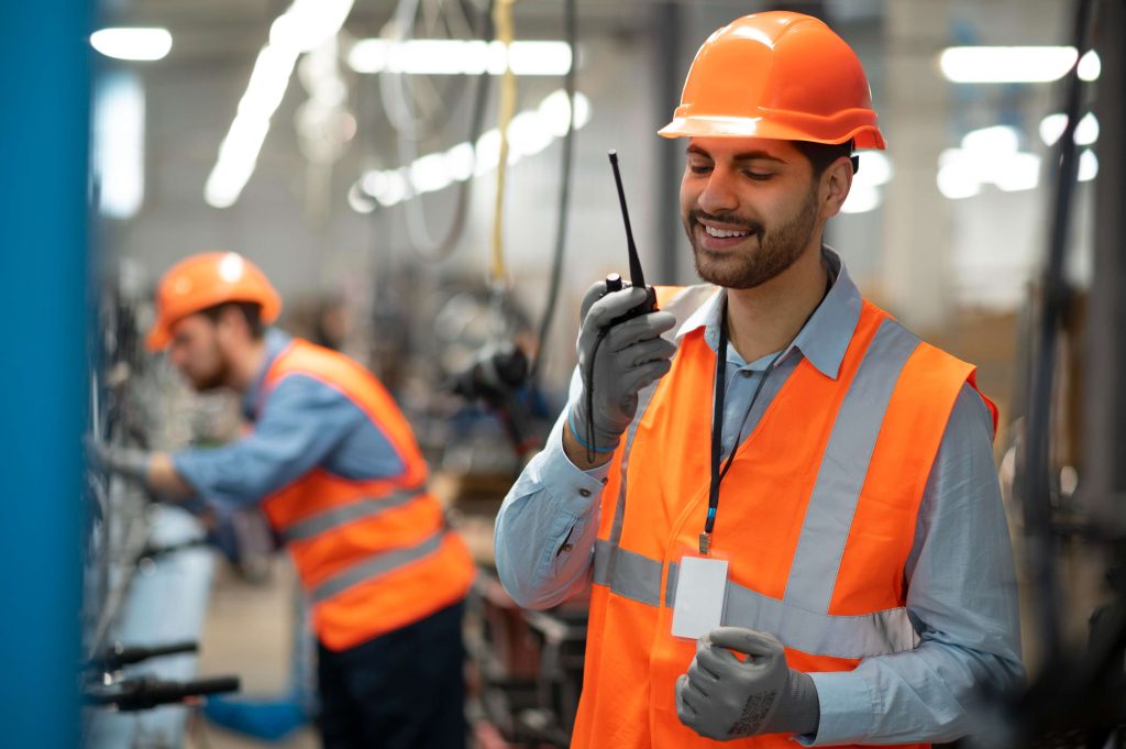 man-safety-equipment-with-walkie-talkie-his-workplace
