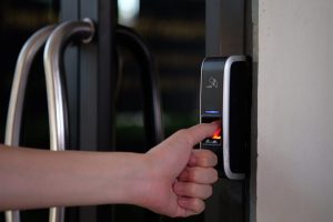 fingerprint-biometric-access-control-reader-at-entrance-to-building